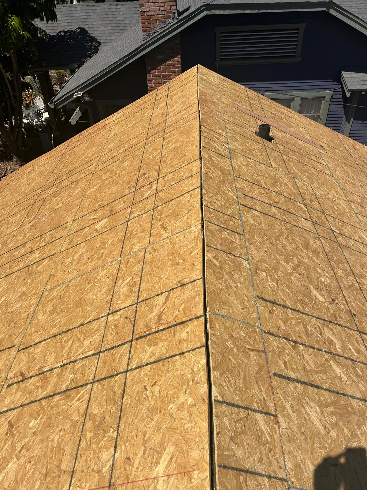 Fresh OSB roof deck with chalk lines marked
