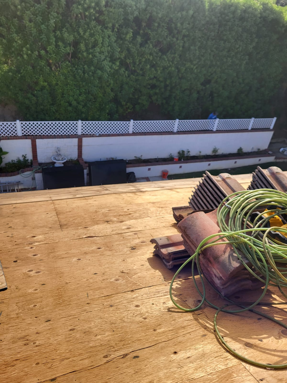 Clean plywood deck with concrete tiles ready for installation