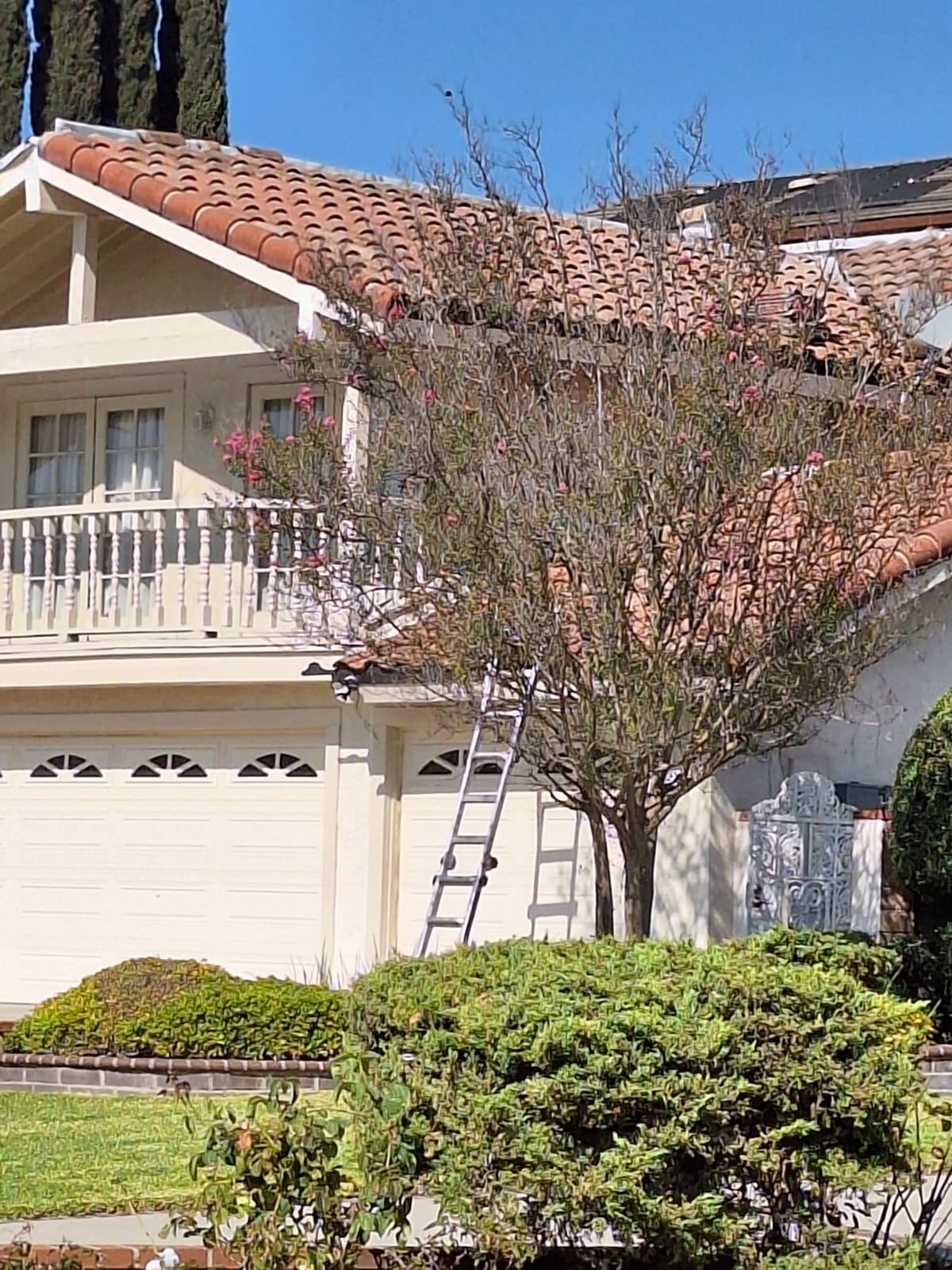 Spanish-style house with terracotta tiles and landscaping